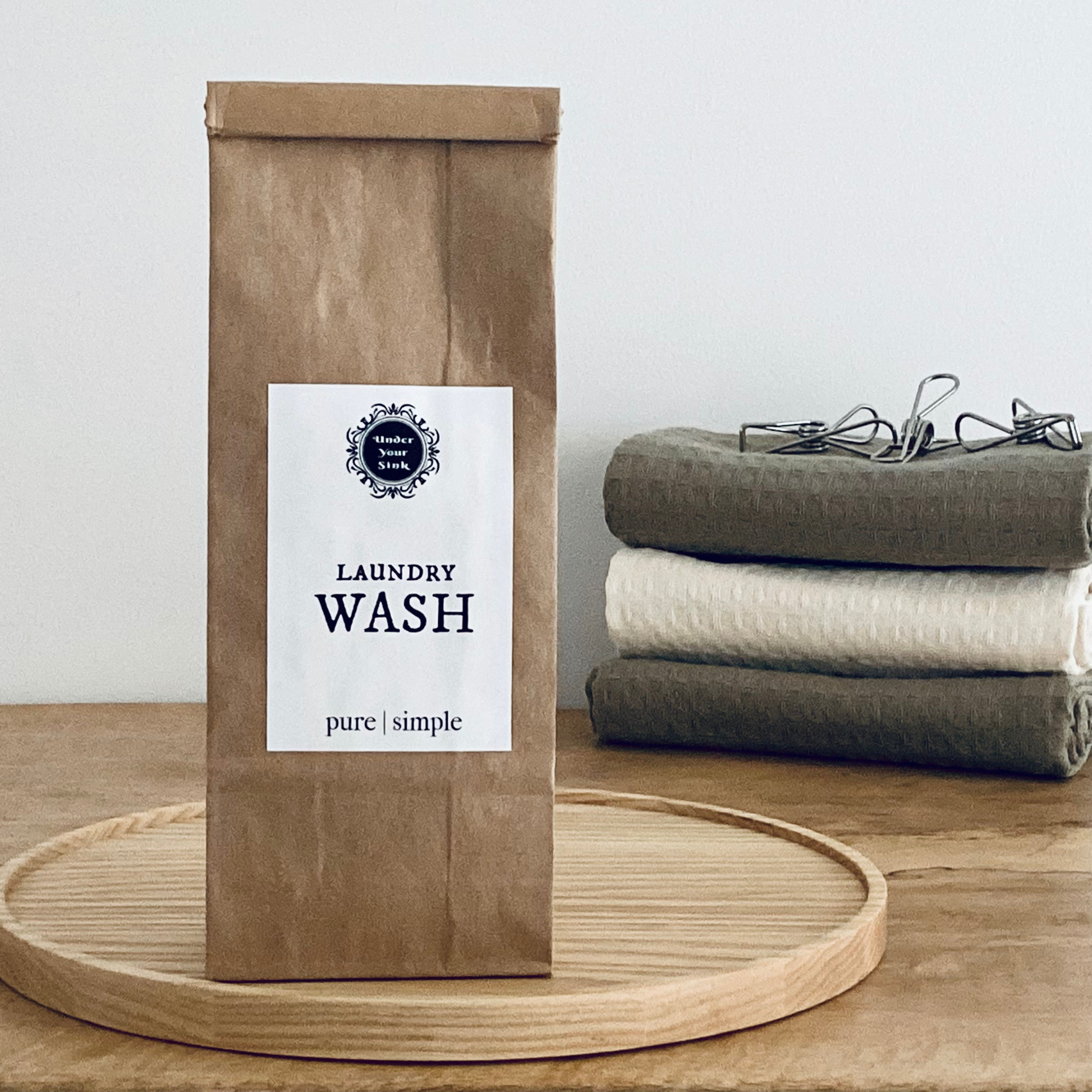 Handmade laundry washing powder for sale in stylish amber glass jar or eco paper bag for natural zero waste cleaning