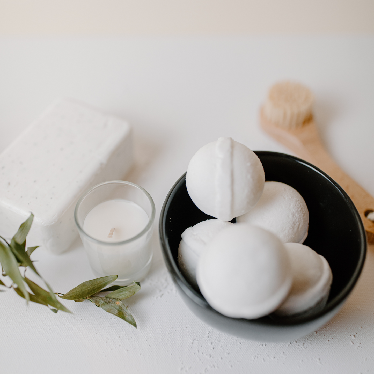 A bowl of white small bath bombs using Citric Acid and Bicarb Soda