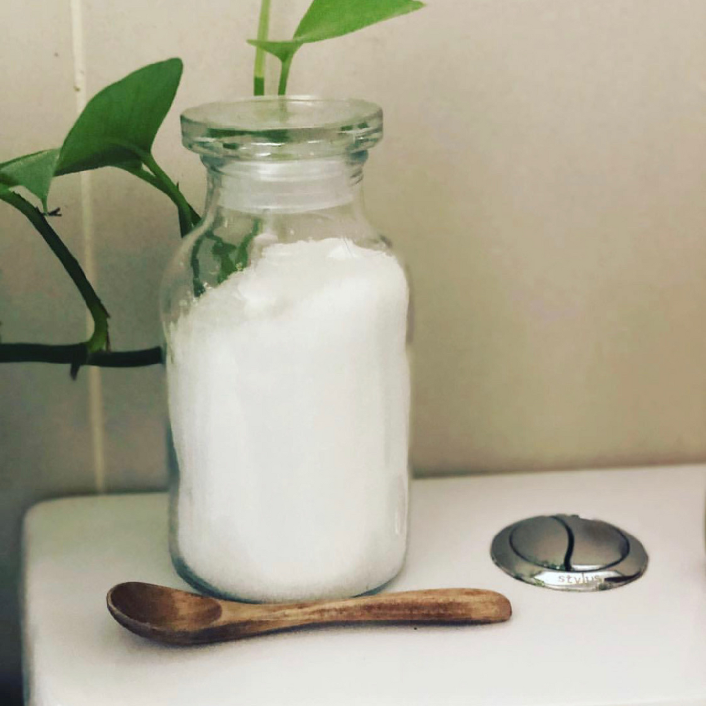 Jar of citric acid on a toilet as toilet cleaner