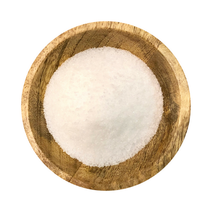 Citric Acid granules in a wooden bowl