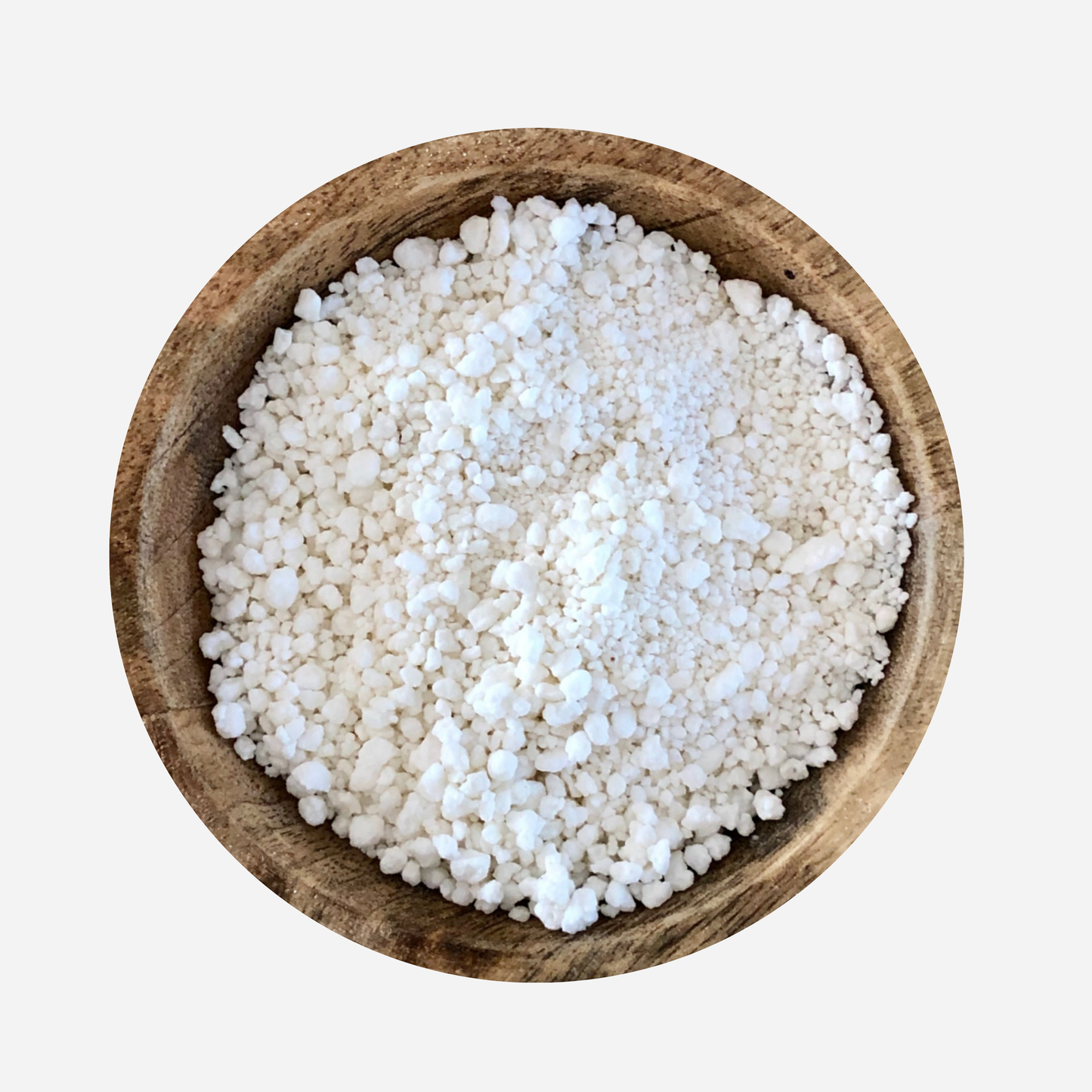 organic coconut soap flakes in a wooden bowl. White grated coconut soap for natural cleaning and  DIY laundry washing powder